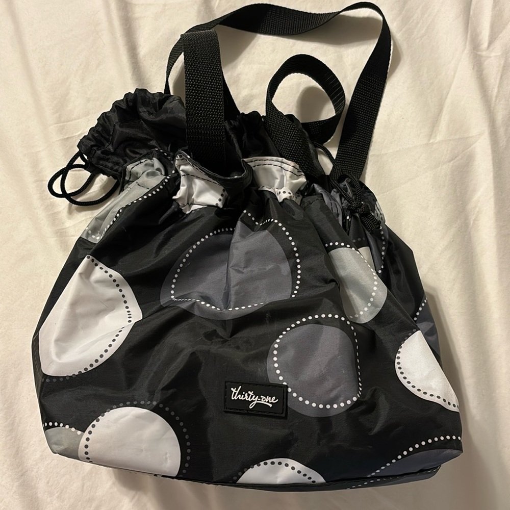 Thirty-one insulated bag with cinch closure at the top.
